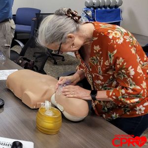 CPR training session with adult mannequin in Laredo.