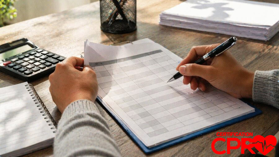 Person filling out a form for CPR certification in Laredo, Texas.