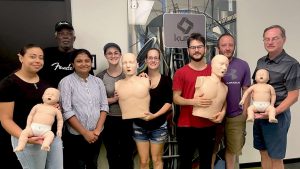 Group CPR training session with mannequins in Laredo.