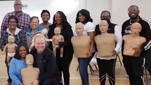 Group CPR training session with mannequins in Laredo.